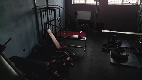 Gym-equipment-in-a-small-dark-room