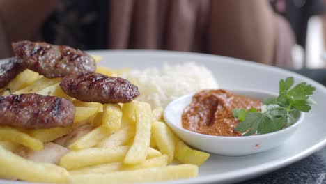 delicious turkish köfte with fries and rice