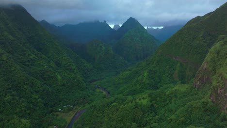 cloudy morning vallee de tautira river tahiti island french polynesia aerial drone valley bay vaitepiha village teahupoojagged mountain aorai peak aorai taiarapu taravao north shore cloudy backwards
