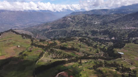 Beautiful-drone-shot-of-the-huge-green-hills-and-valleys-insede-the-highlands-in-Ancash-Peru