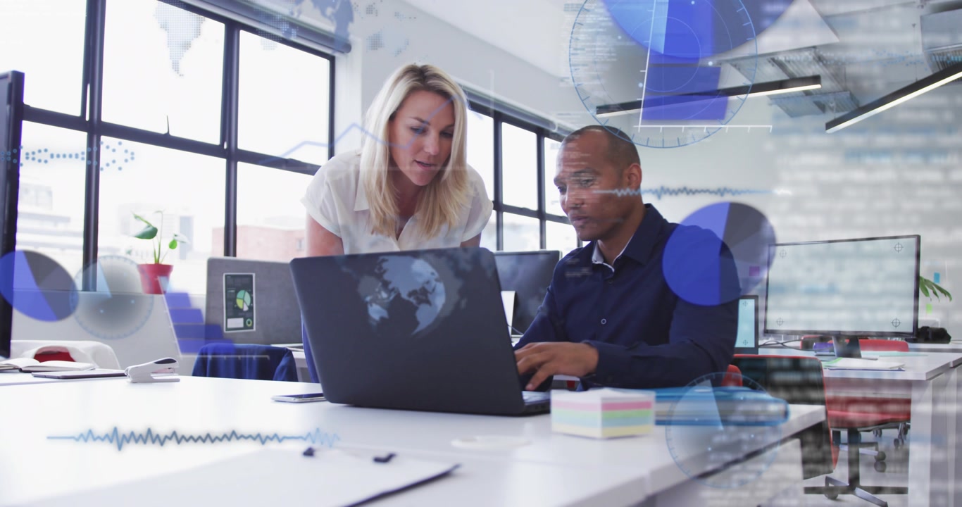 Leaning colleagues in white blouse and navy shirt discussing laptop in office with blue overlays