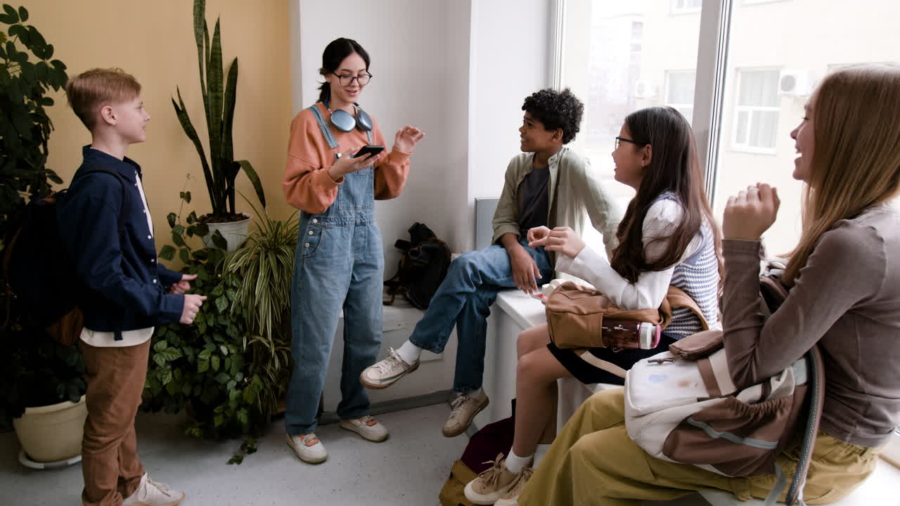 Students chatting and socializing in a school hallway
