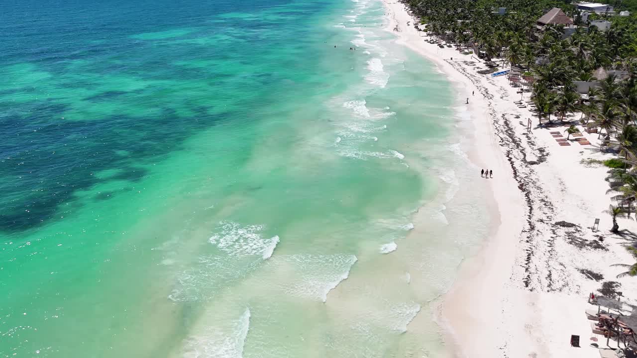 Drone Shot of Tulum Mexico Beach, White Sand, Turquoise Caribbean Sea and Palm trees