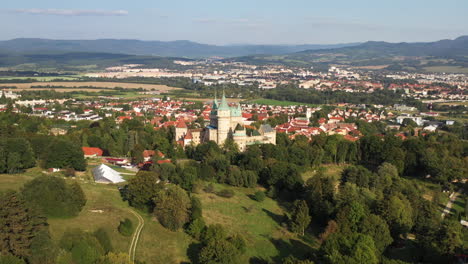 wide drone shot descending to a fly by of the castle of spirits or bojnice castle in slovakia