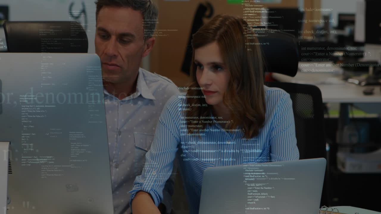 Programming code animation over two colleagues working on computers in office