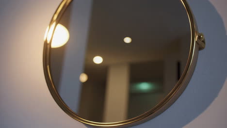 round gold framed wall mirror