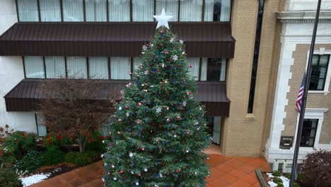 aerial of a large christmas tree and snow