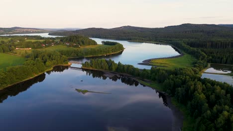 view while smoothly looking at the wide blue river that flows through the landscape