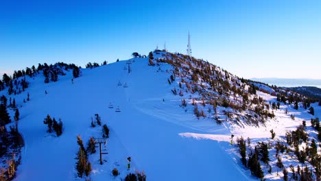 Aerial-view-sunny-afternoon-over-California-snowy-mountains-in-Lake-Tahoe-area