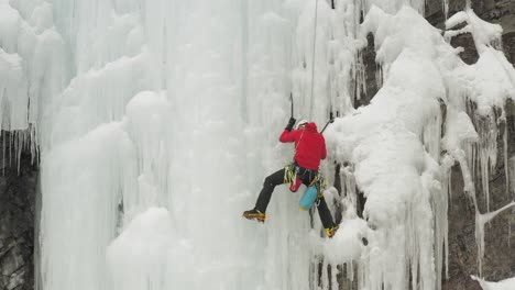 climber scales huge ice cascade maineline, kineo mountain 4k