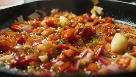 close up on frying pan with vegetable mix