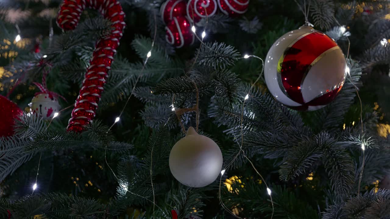 Christmas tree with fairy lights and trimmings. Decorations and balls with festive concept. Merry Christmas