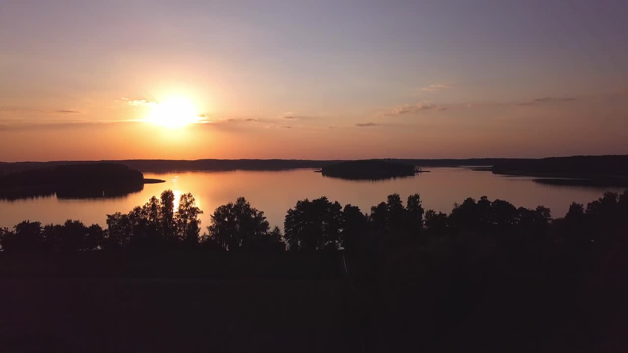Sunset Over Lake Aerial. Slow Forward Move