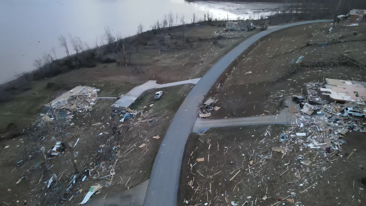Drone video of home damage after a tornado on Lake Barkley,  Kentucky.  2021-12-10. Beautiful lake homes were destroyed by a very strong tornado. Dramatic debris trail visible