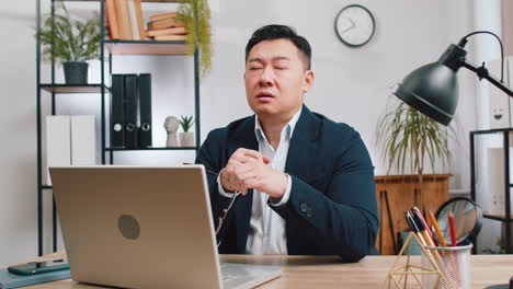 Asian businessman worried about financial problem stress money debt budget loss bankruptcy