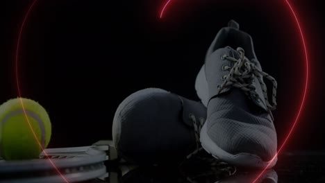 animation of neon hearts over ball and sport shoes