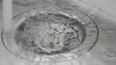 water draining into sink drain