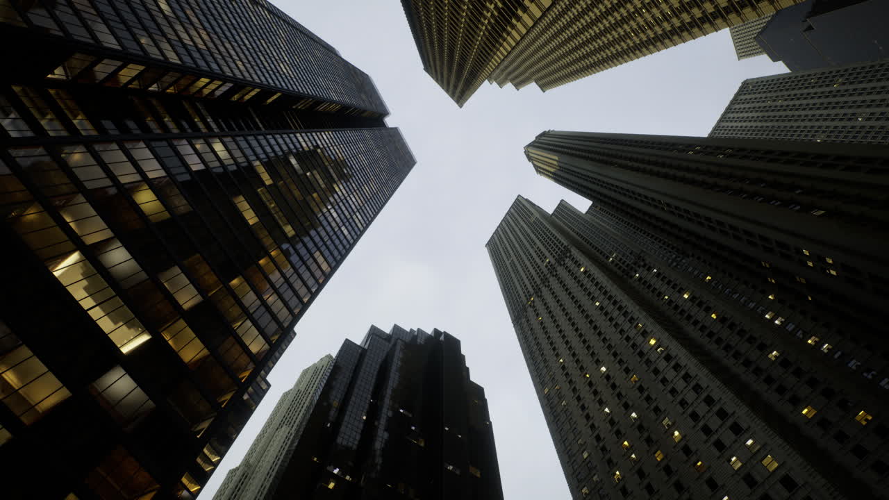 Skyscrapers rise to meet the cloudy sky in a vibrant metropolis at dusk