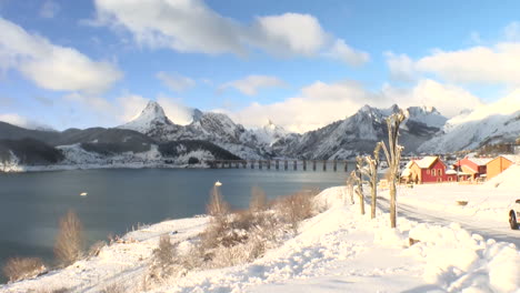 Snowy Mountain Landscape with Lake and Village