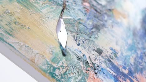 super slow motion 240 fps the artist paints an abstract picture in the studio - super slow motion 240 fps, the artist paints an abstract picture in the studio. a modern artist paints an emotional, sensual oil painting