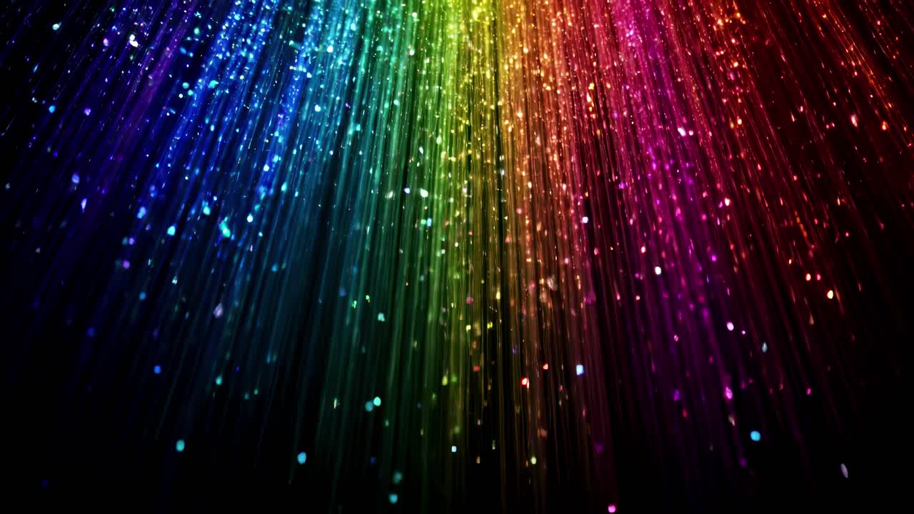 Vibrant, multicolored light streaks cascade downward, captured from a low angle