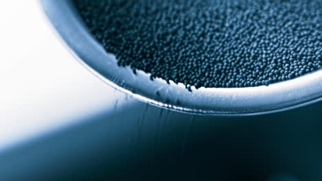 close-up of hourglass sand flowing