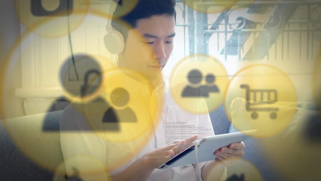 디지털 태블릿을 사용하여 헤드폰을 착용 한 남자에 대한 디지털 아이콘