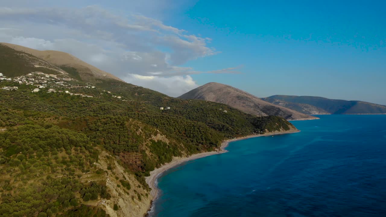 Panoramic seaside on Mediterranean with mountains and olive trees hills surrounded by blue azure sea water