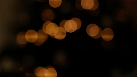 blurred shot of christmas tree with lighting fairy lights