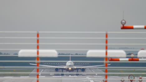 airplane landing at rainy weather