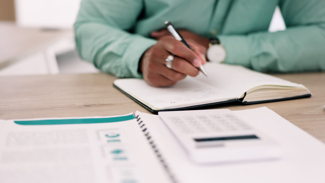 Calculator, hands and accountant writing in book