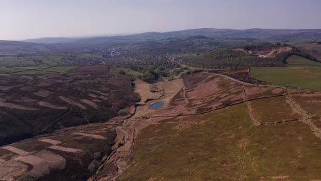 aerial drone flyover farm in peak district united kingdom