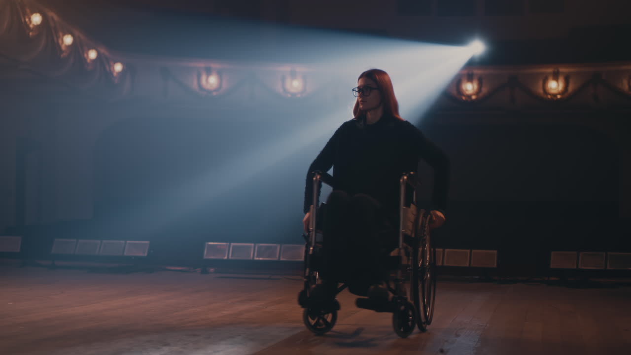 Handicapped Actress Leaving Stage in Theater Woman Turning Wheelchair Round and Leaving Stage in End of Performance in Theater