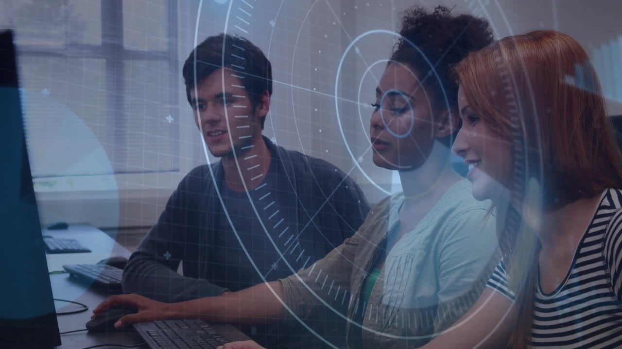 In school, three people working on computers with animation overlaying screen