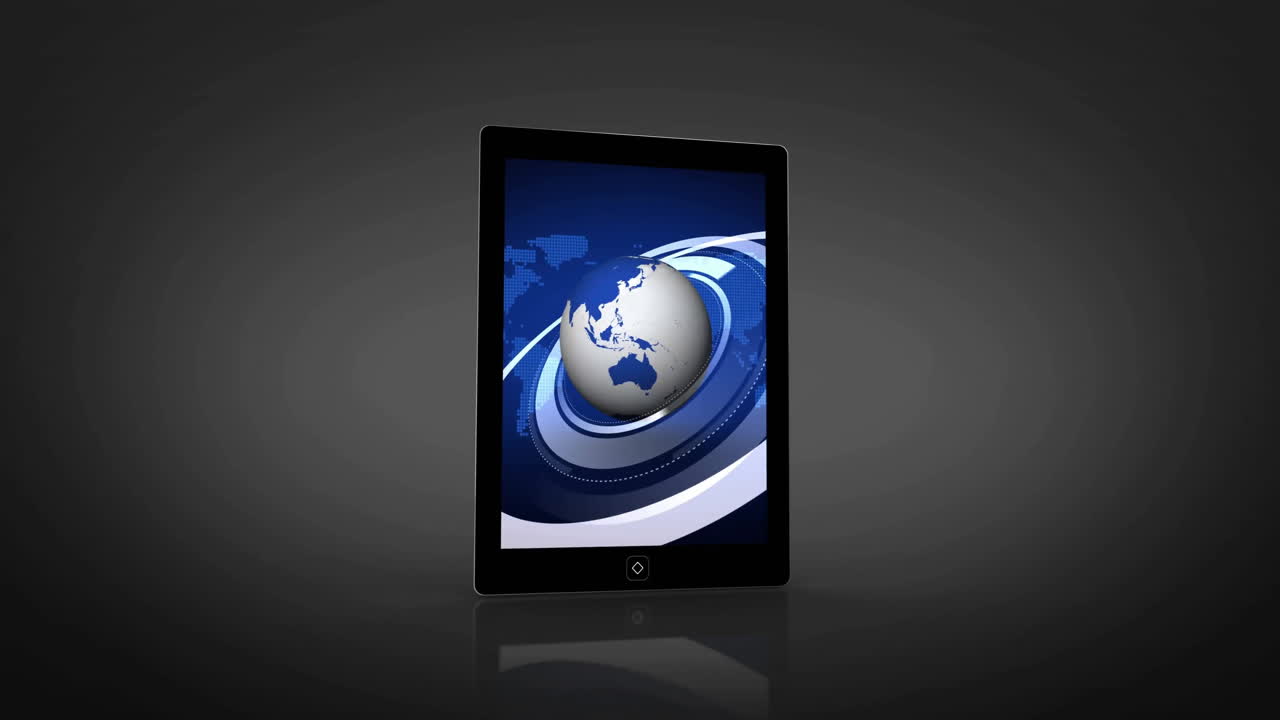Rotating globe and digital rings animating over tablet screen in close-up view