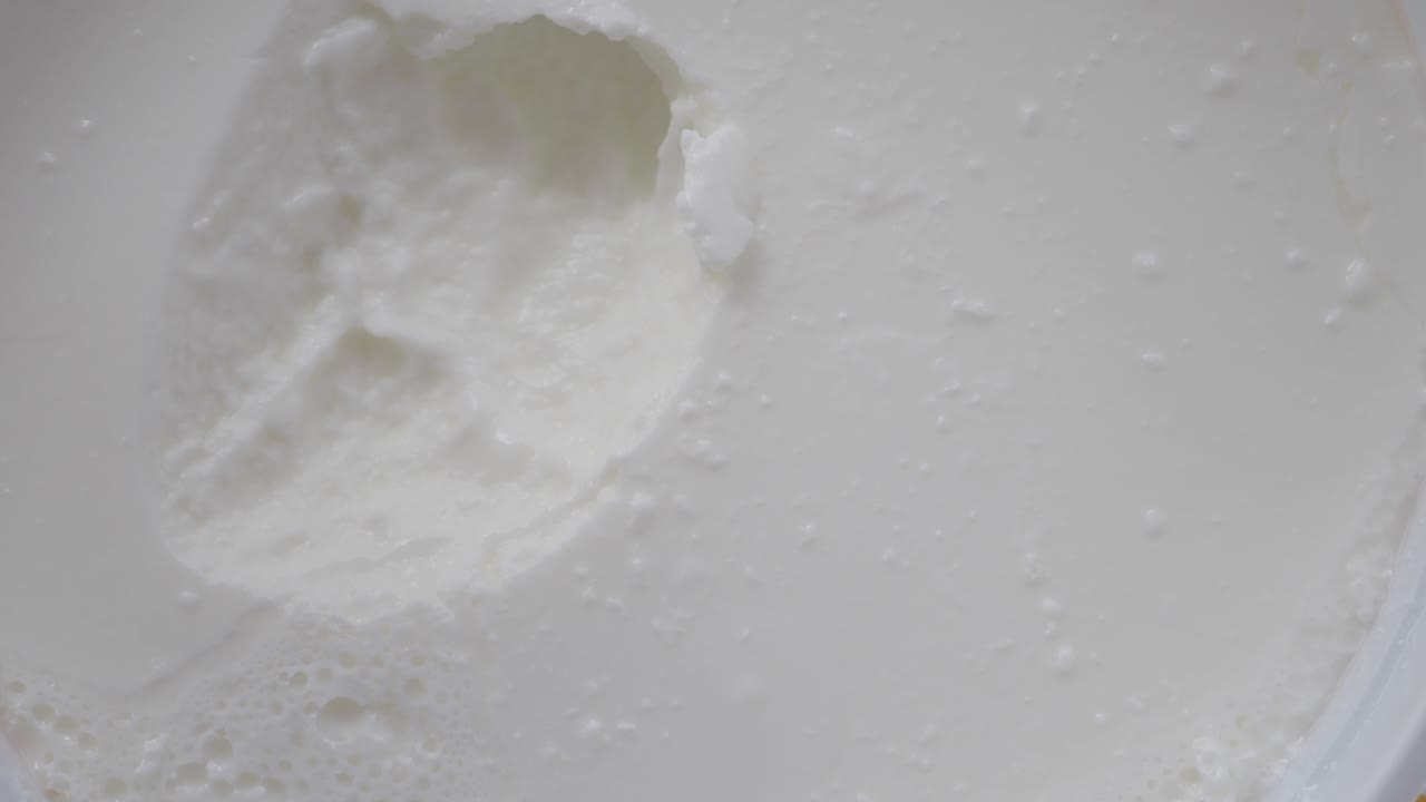 Close-up of Creamy Yogurt with a Spoon