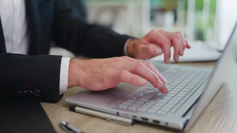 office worker writing on laptop