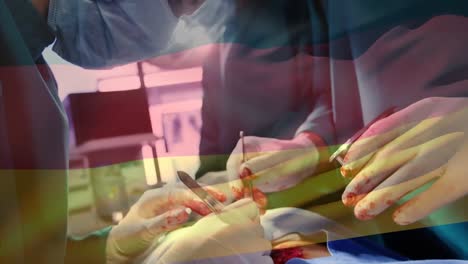 Animation-of-flag-of-germany-waving-over-surgeons-in-operating-theatre