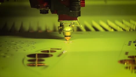 CNC-Laser-cutting-of-metal-in-slow-motion,-modern-industrial-technology.