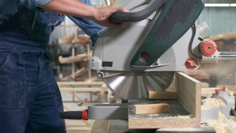 man working with circular saw