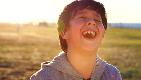 child, laughing and face with a boy laughing alone