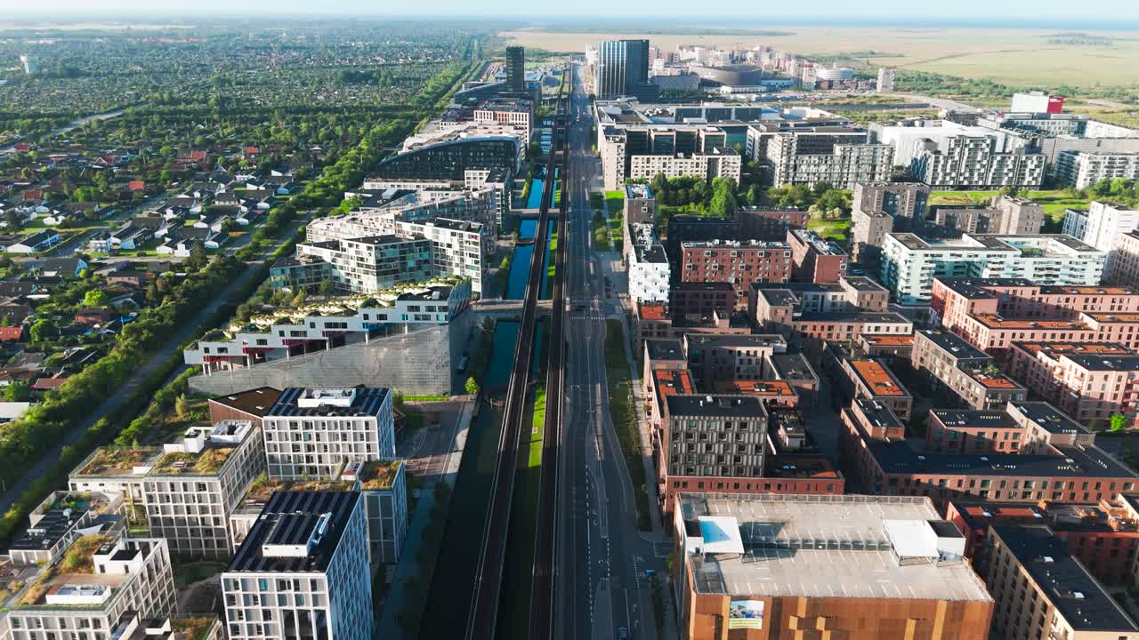 Aerial view of Orestad main metro line through city neighborhood, Denmark