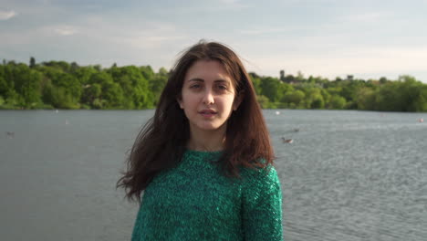 Gorgeous-Italian-fashion-model-posing-in-her-outfit-in-front-of-a-lake-in-London-at-golden-hour