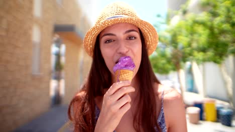 beautiful brunette female tourist eating ice cream on summer holidays