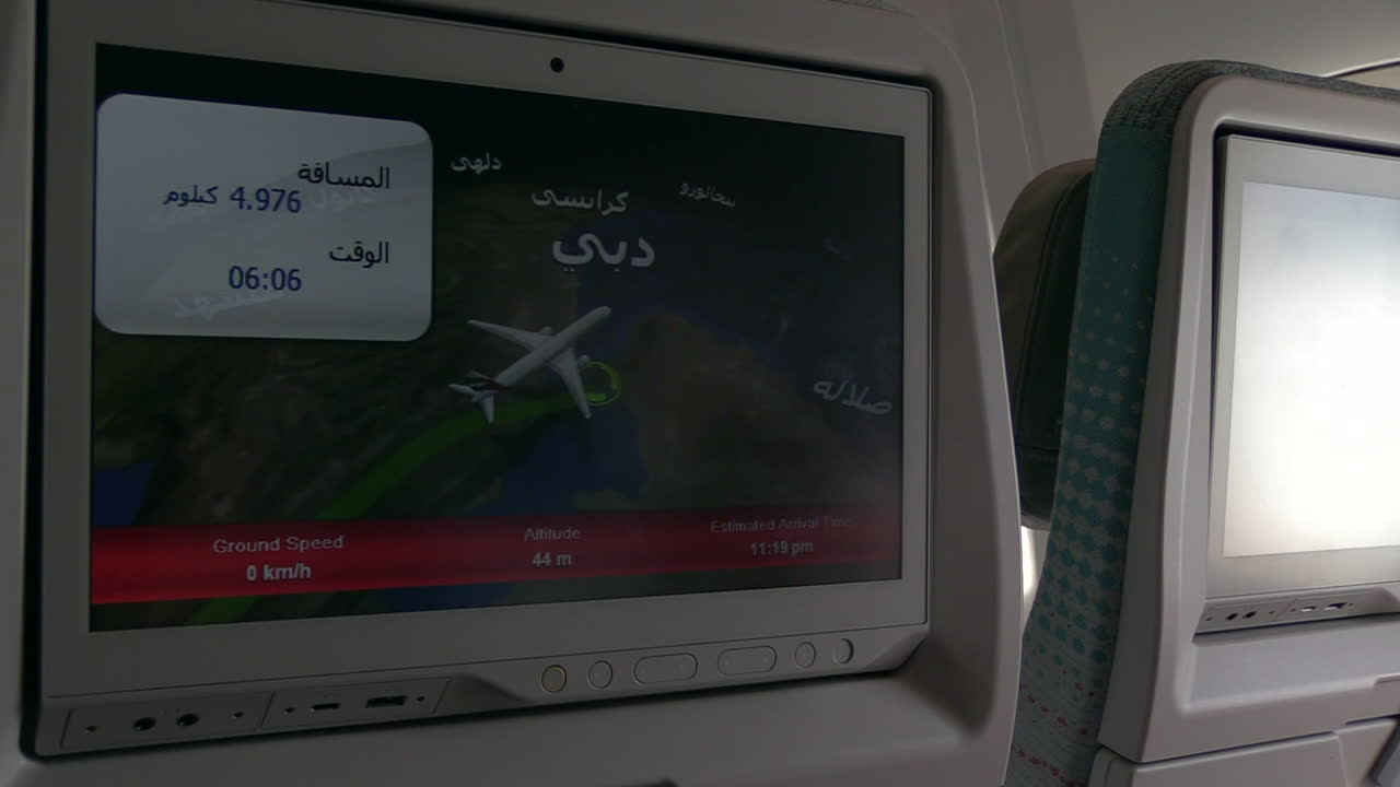 young boy checking out the Emirates Airbus A380 In-Flight Entertainment