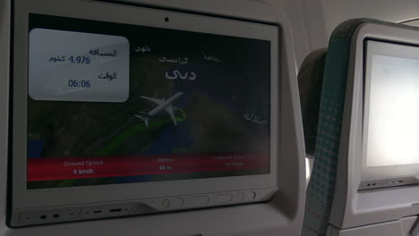 young boy checking out the emirates airbus a380 in-flight entertainment