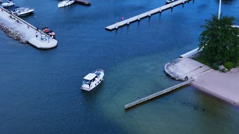 Private yacht returning to marina, aerial view