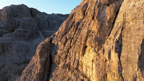 High-altitude-drone-footage-reveals-the-expansive-beauty-of-the-Dolomites,-with-valleys-and-peaks-bathed-in-the-tranquil-light-of-early-morning