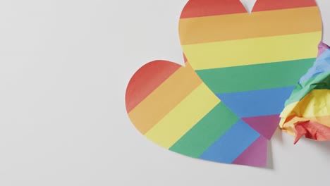 Video-of-rainbow-hearts-over-white-surface-with-copy-space