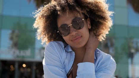 confident trendy woman in sunglasses